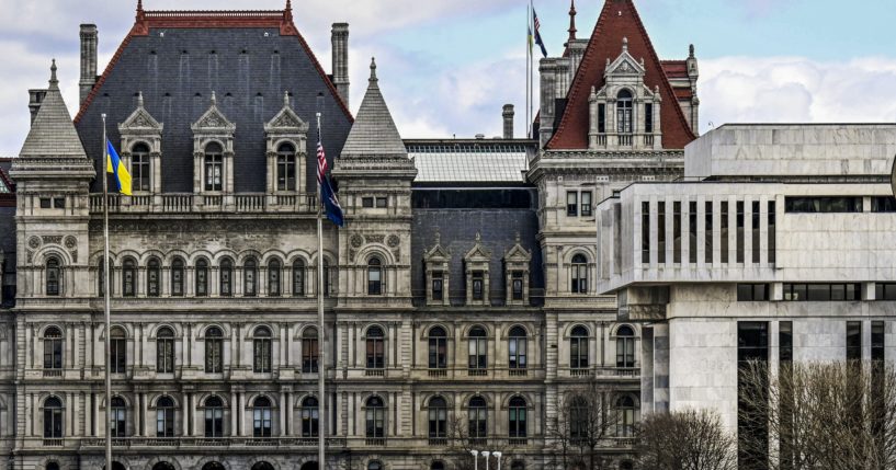 A partial view of the New York state Capitol building, left, is shown next to the state appellate court building in Albany, N.Y. A panel of five New York appellate judges has ruled that state Democrats engaged in gerrymandering when drawing new congressional district boundaries for the next decade.