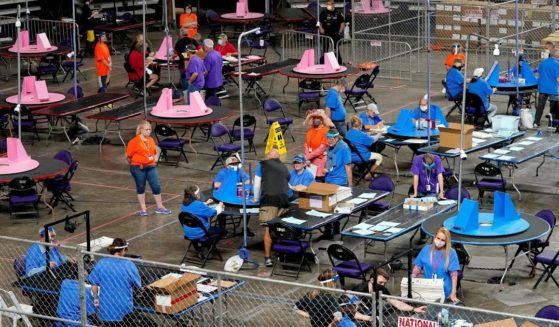 Contractors from Cyber Ninjas examined and recounted Maricopa County ballots cast in the 2020 general election in the Veterans Memorial Coliseum in Phoenix, Arizona, on May 6, 2021.