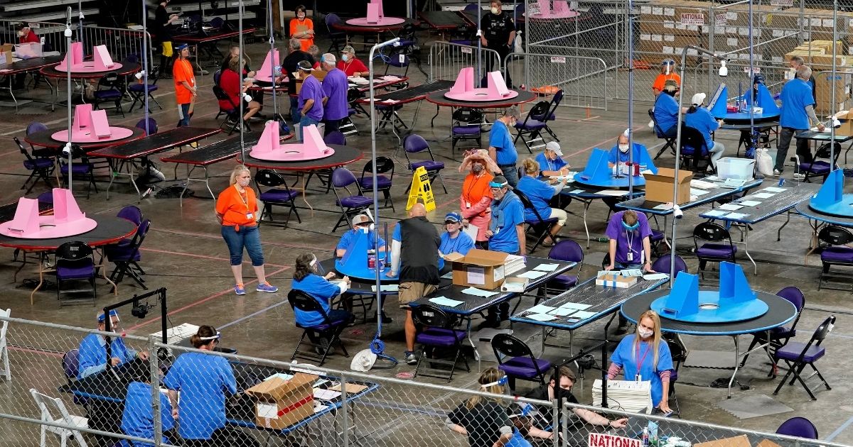 Contractors from Cyber Ninjas examined and recounted Maricopa County ballots cast in the 2020 general election in the Veterans Memorial Coliseum in Phoenix, Arizona, on May 6, 2021.