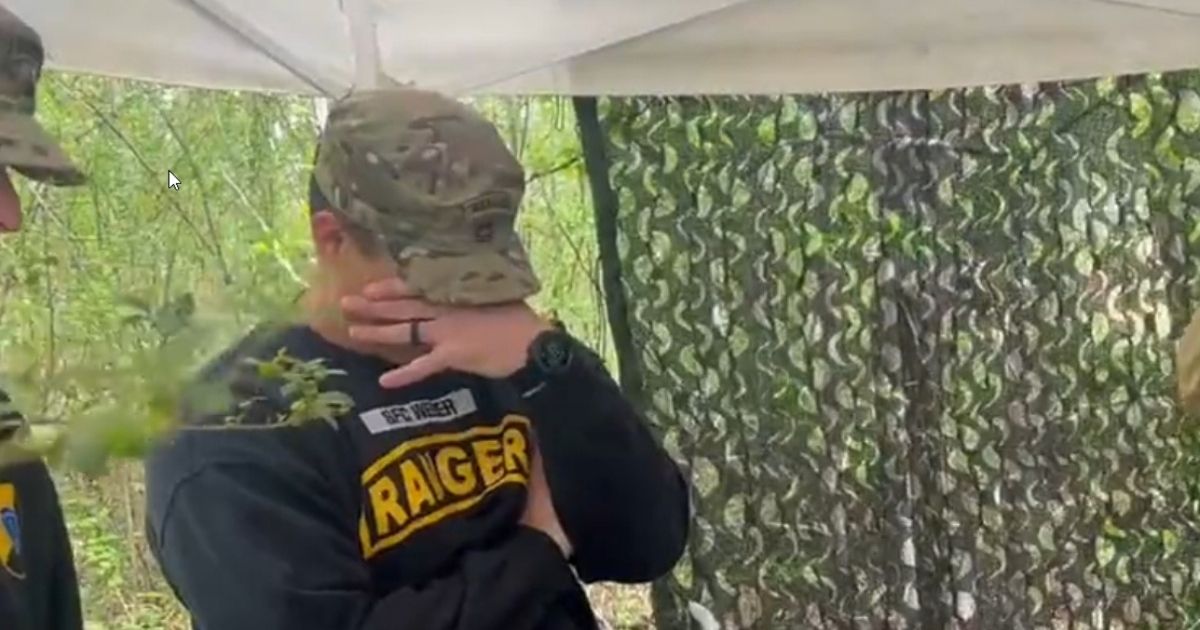 An Army Ranger instructor reacts when Team 41 works through the "mystery event" during the 2022 Best Ranger Competition in Fort Benning, Georgia.