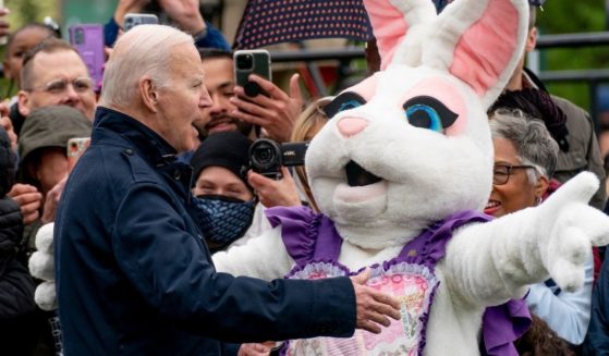 The Easter Bunny confronts President Joe Biden during the Easter Egg Roll at the White House in Washington on Monday.