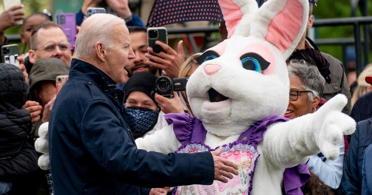 The Easter Bunny confronts President Joe Biden during the Easter Egg Roll at the White House in Washington on Monday.