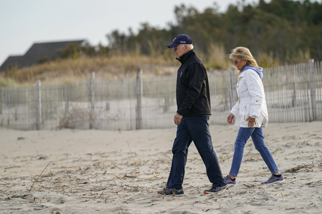 President Joe Biden and first lady Jill Biden walk along the beach in Rehoboth Beach, Del., in a file photo from November 2021. Biden spent close to 30 percent of his time in Delaware during the first year of his presidency, yet the Secret Service has said there are no visitor logs for either of Biden's homes in the state.