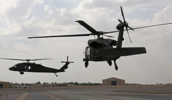 UH-60 Black Hawk helicopters carrying U.S. and Afghan trainees take off from Kandahar Air Field, Afghanistan, on March 19, 2018.