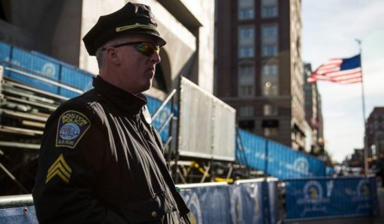 A police officer stands guard near the finish line of the Boston Marathon in Boston on April 20, 2014.