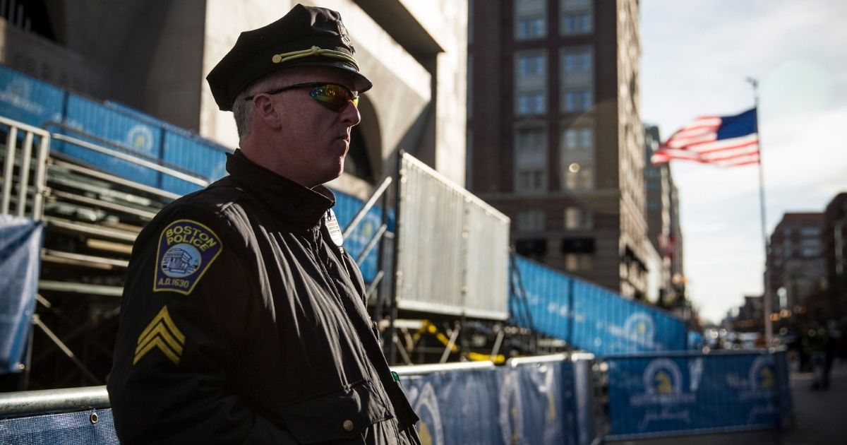 A police officer stands guard near the finish line of the Boston Marathon in Boston on April 20, 2014.