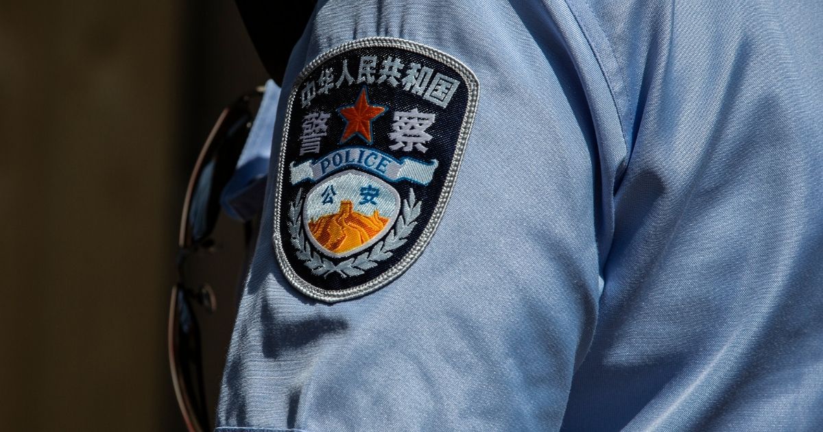 The patch on the arm of a Chinese policeman is pictured during a patrol on June 1, 2018.