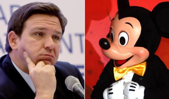 Florida Gov. Ron DeSantis, left, and Walt Disney Co. mascot Mickey Mouse.
