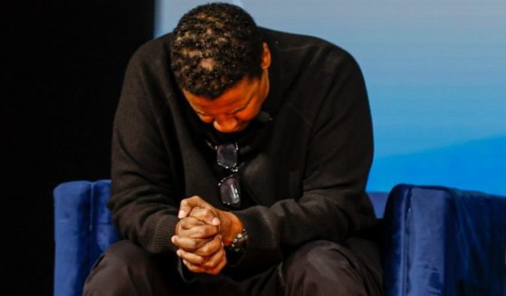 Actor Denzel Washington prays over the The International Leadership Summit 2022 in Charlotte, North Carolina, on Saturday.