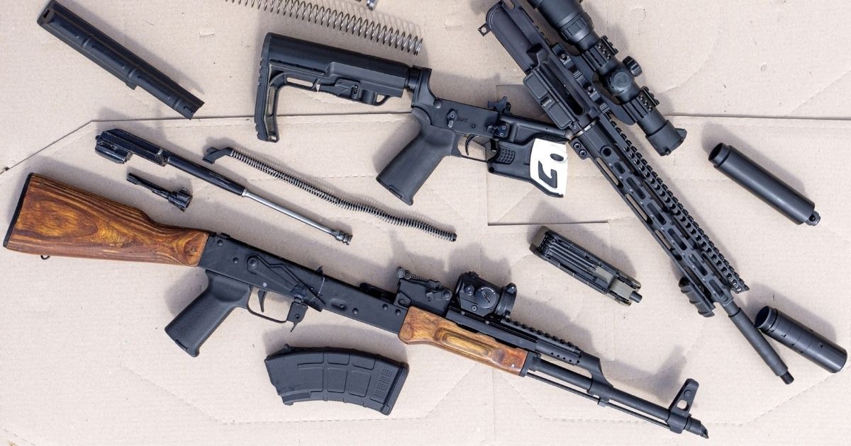 Disassembled AK and AR-15 rifles.