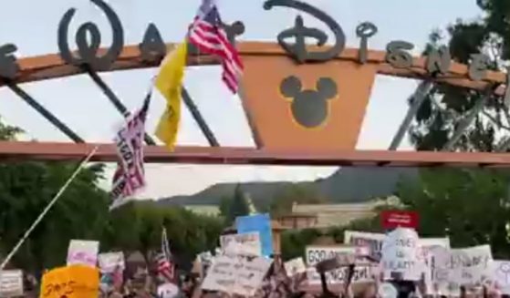 Protesters chanted 'Boycott Disney' and spoke out against the company's left-leaning stances outside the gates of the Walt Disney Studios in Burbank April 6.