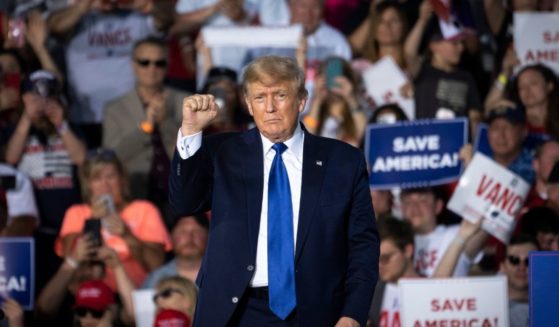 Former President Donald Trump gestures after speaking at a rally at the Delaware County Fairgrounds on Saturday in Delaware, Ohio.