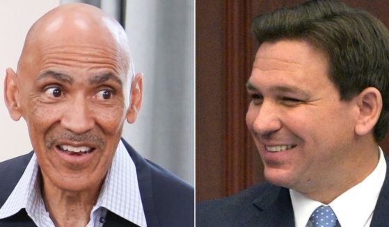 At left, Tony Dungy speaks during an event at Universal Studios Hollywood in Universal City, California, on July 20, 2018. At right, Florida Gov. Ron DeSantis addresses a joint session of the legislature in Tallahassee on Jan. 11.
