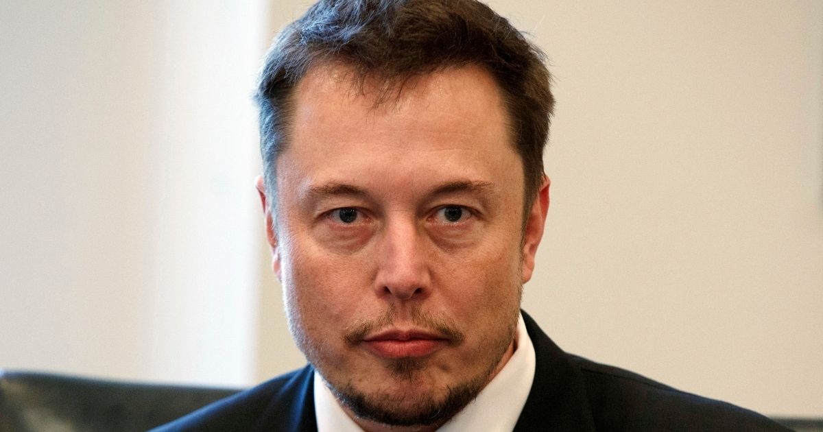 Tesla CEO Elon Musk listened to then-President-elect Donald Trump during a meeting with technology industry leaders at Trump Tower in New York on Dec. 16, 2016.