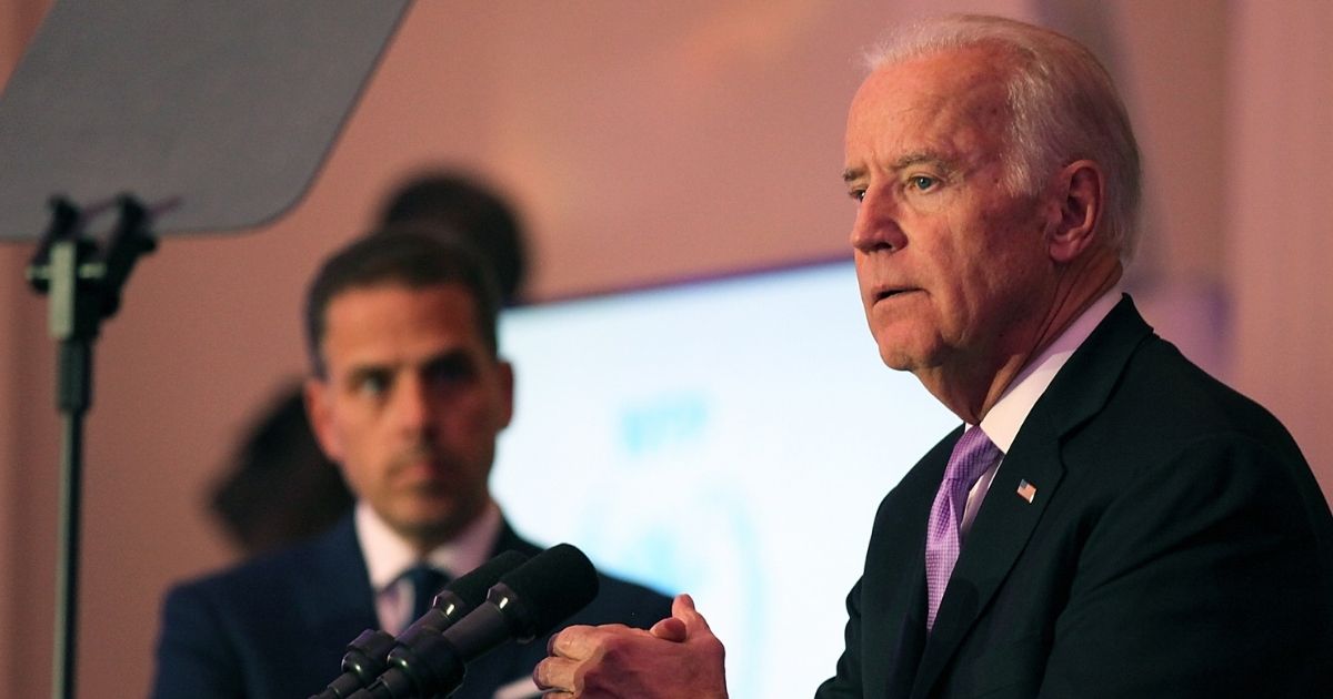 Hunter Biden, left, listens while his father, then-Vice President Joe Biden, speaks during a World Food Program USA event at the Organization of American States in Washington on April 12, 2016.