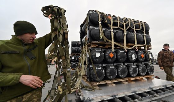 Ukrainian servicemen unload anti-tank Javelin missiles provided by the U.S. to Ukraine on Feb. 11 in Kyiv.