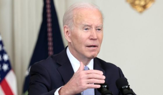 President Joe Biden speaks in the State Dining Room of the White House in Washington on Friday.