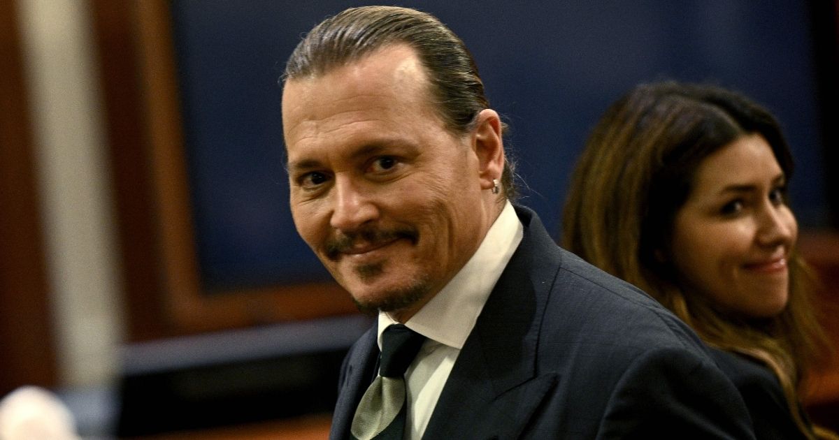 Johnny Depp smirks in the courtroom at the Fairfax County Circuit Courthouse in Fairfax, Virginia, on Tuesday.