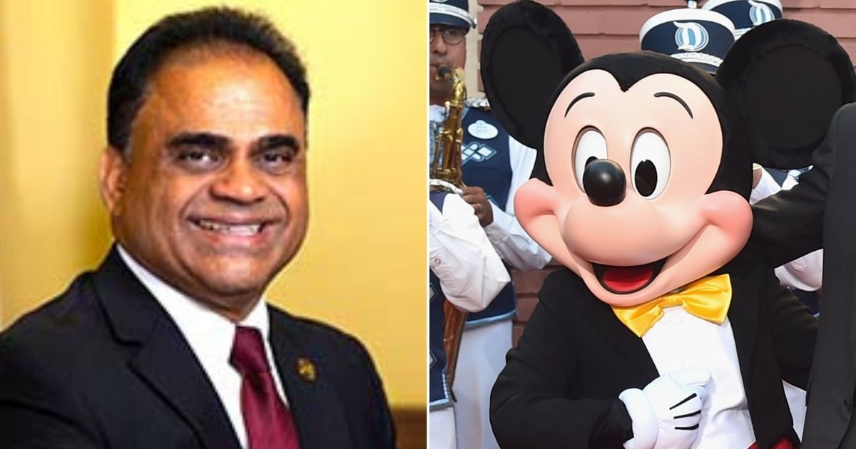 Fort Bend County Judge KP George, left, and Mickey Mouse, right.