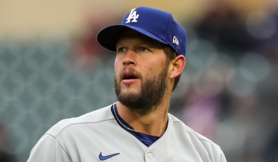Clayton Kershaw of the Los Angeles Dodgers walks to the dugout after recording a strikeout against Nick Gordon of the Minnesota Twins to end the sixth inning at Target Field in Minneapolis on Wednesday.