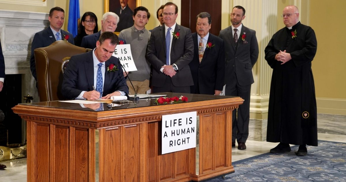 Republican Gov. Kevin Stitt of Oklahoma signed a bill on Tuesday that protects unborn children from abortion in nearly all cases.