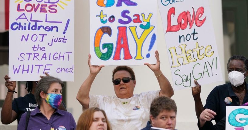 Protestors hold signs on the steps of the Florida Historic Capitol Museum in front of the Florida State Capitol to protest Gov. Ron DeSantis' Parental Rights in Education bill and advocate for LGBTQ+ students. However, a recent CDC study has determined that high school students who identify as LGBTQ+ are afflicted with higher depression rates.