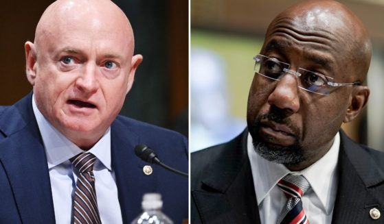 Sen. Mark Kelly, left, speaks during a Senate Finance Committee hearing on Capitol Hill in Washington, D.C., on Oct. 19, 2021. Sen. Raphael Warnock participates in a Senate Banking, Housing and Urban Affairs Committee hearing on Capitol Hill on Feb. 3 in Washington.