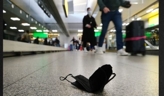 A mask is seen on the floor at John F. Kennedy Airport on April 19 in New York City, after a federal judge in Florida struck down the mask mandate for airports and other methods of public transportation. Biden administration officials indicated they will 'likely' appeal the judge's decision.
