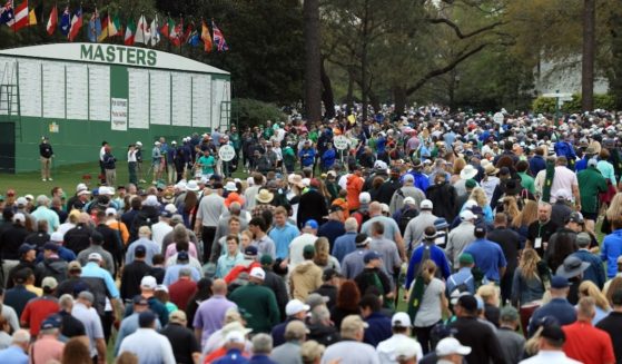 Spectators are seen during the Masters at Augusta National Golf Club on Tuesday in Augusta, Georgia.