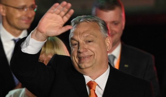 Hungarian Prime Minister Viktor Orban and members of the Fidesz party celebrate their victory on stage at the Balna building on the bank of the Danube River in Budapest on Sunday.