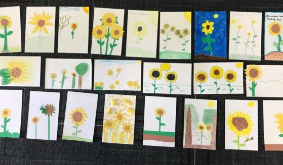 Utah schoolchildren drew pictures for Ukranian children recently to be sent with donated relief items. Many of the drawings featured sunflowers, the Ukranian national flower. Some had messages of encouragement. The gifts were carried overseas by a local man who helped distribute them at a refugee center in Poland.