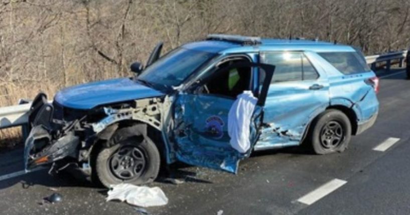 On March 16, a police car was crushed by a passing tractor-trailer drifting into the lane. The tractor-trailer then went into another lane, hitting a family vehicle and pinning it.