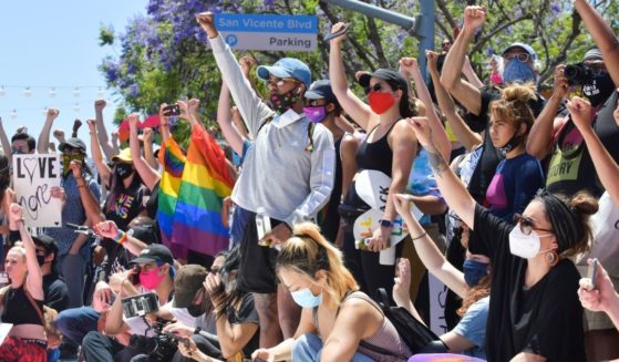 Protesters show their support for both gay pride and black lives matter at the All Black Lives Matter Solidarity March in Los Angeles, California, on June 14, 2020.