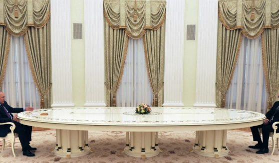 Russian President Vladimir Putin is seen meeting with his Azerbaijani counterpart Ilham Aliyev at the Kremlin in Moscow on Feb. 22. Rumors of declining physical or mental health have been sparked by reports of Putin surrounding himself with doctors and distancing himself from others using extremely long tables.