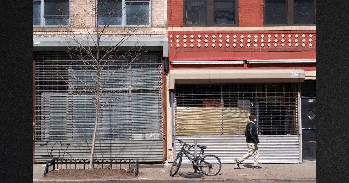 Vacant New York City storefronts are seen in a file photo from April 2021. A large multinational bank is predicting a major recession for the US.