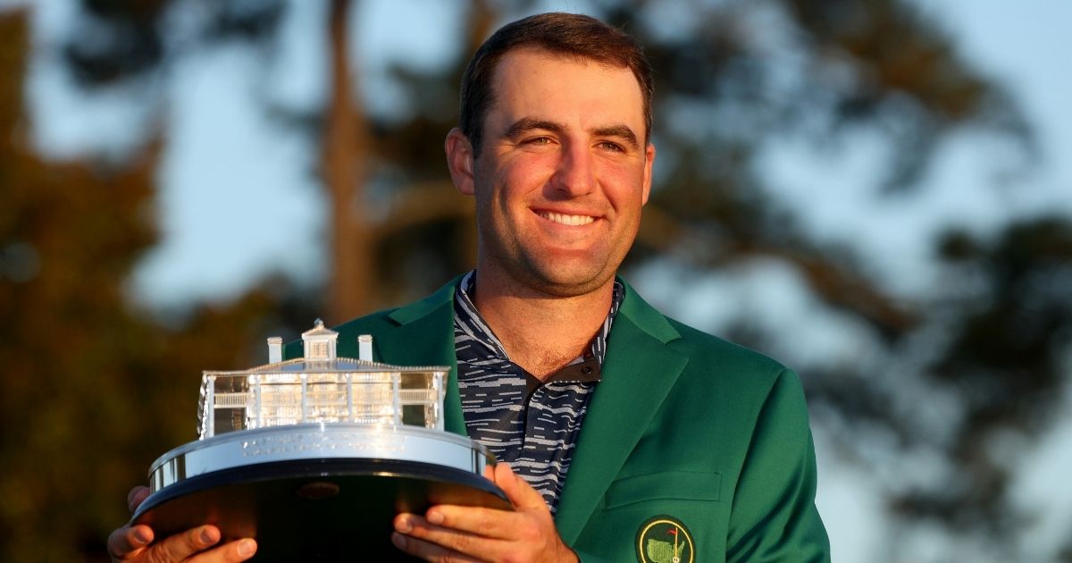 Scottie Scheffler poses with the Masters trophy during the Green Jacket Ceremony after winning the Masters at Augusta National Golf Club in Augusta, Georgia, on Sunday.