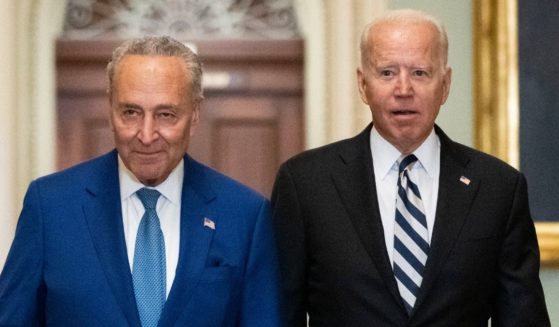 Senate Majority Leader Chuck Schumer, left, and President Joe Biden arrive at the U.S. Capitol for a Senate Democratic luncheon on July 14.