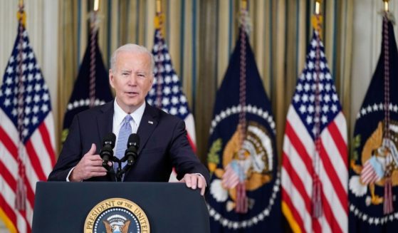 President Joe Biden speaks in the State Dining Room of the White House on Friday in Washington, D.C.