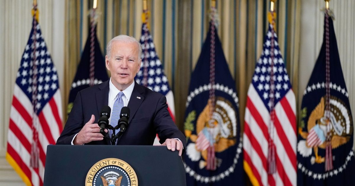President Joe Biden speaks in the State Dining Room of the White House on Friday in Washington, D.C.