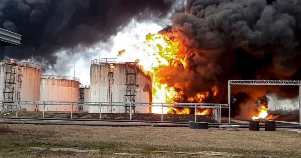 A fire rages at an oil depot in Belgorod, Russia, on Friday. Russian officials have accused Ukraine of flying helicopter gunships into Russian territory and striking the depot.