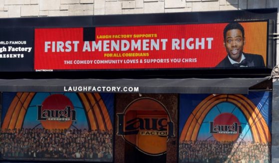 A message expressing support for comedian Chris Rock is displayed on the digital marquee of the Laugh Factory comedy club on Wednesday in Los Angeles.