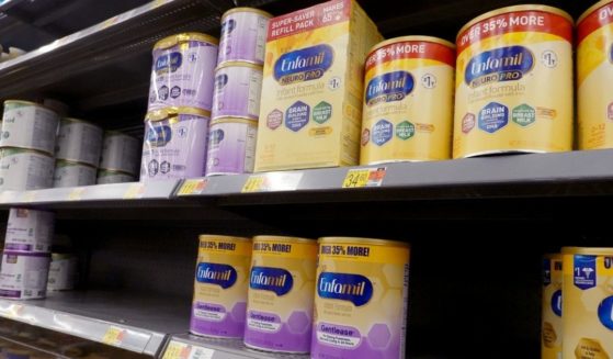 Shelves at a Chicago area store show empty spots where baby formula has sold out.
