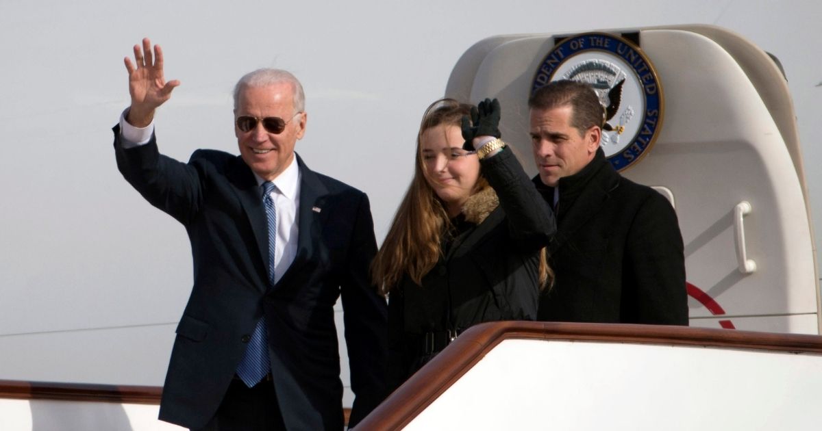 Then-Vice President Joe Biden, his granddaughter Finnegan Biden, and son, Hunter Biden, are pictured in a 2013 file photo arriving in Beijing, China. 