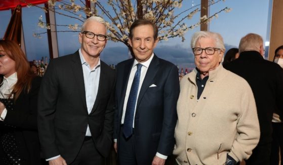 CNN+ personalities Anderson Cooper, left, and Chris Wallace, center, are pictured with journalist Carl Bernstein at the streaming service's March 28 launch party in New York City.