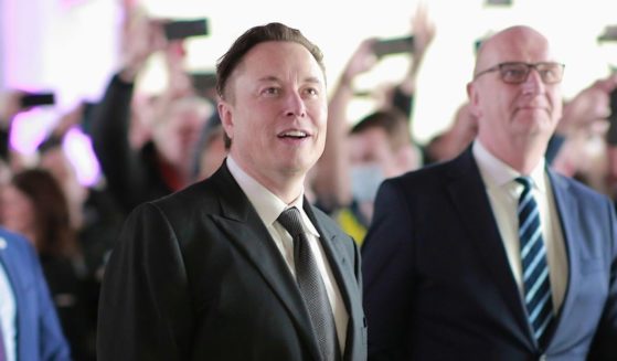 Tesla CEO Elon Musk, pictured in a file photo from March 22 in Gruenheide, Germany, with German Chancellor Olaf Scholz.