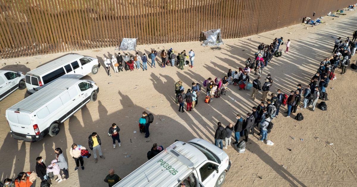 Illegal immigrants are are taken into custody by U.S. Border Patrol agents at the U.S.-Mexico border on December 7 in Yuma, Arizona.