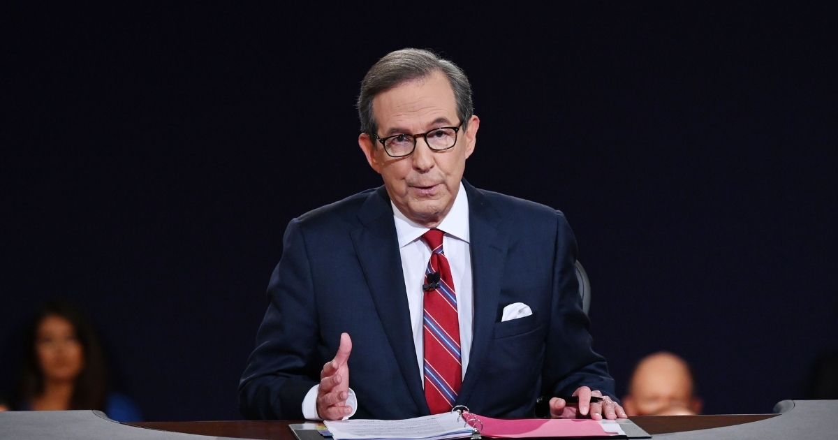 Then-Fox News anchor Chris Wallace is pictured moderating the first presidential debate between in September 2020.