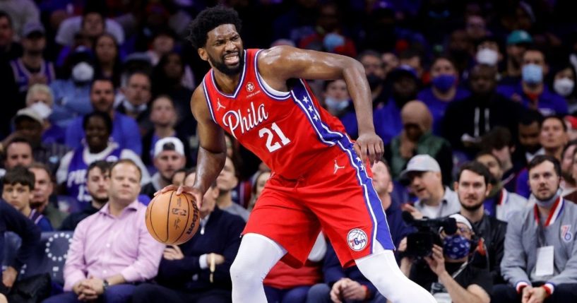 Joel Embiid of the Philadelphia 76ers dribbles during a playoff game against the Toronto Raptors at Wells Fargo Center on Monday. Few masks were worn at the game even though they were required under city rules.