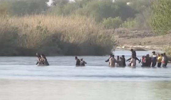 Illegal aliens are pictured crossing the Rio Grande at Eagle Pass, Texas, in a Fox News video from April 2.