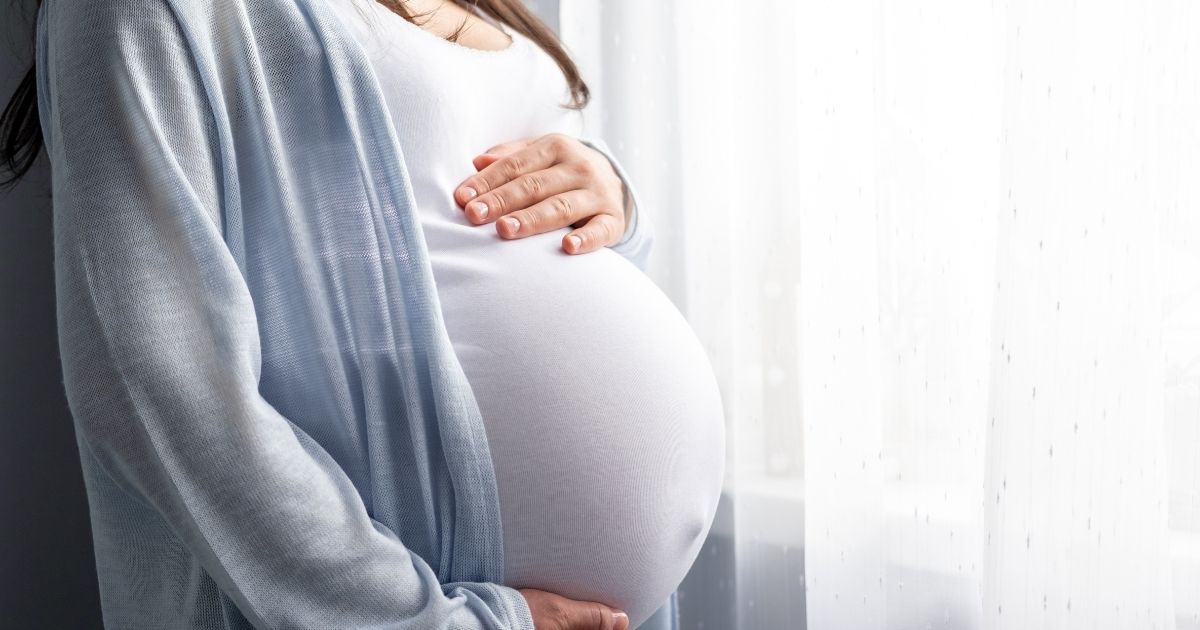 A pregnant woman is seen in this stock image.